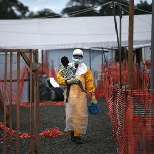 Voted the number one most moving image in the Getty Images curation for 2014, this shot by John Moore shows the despair of the ebola crisis in Liberia. John Moore/Getty Images.